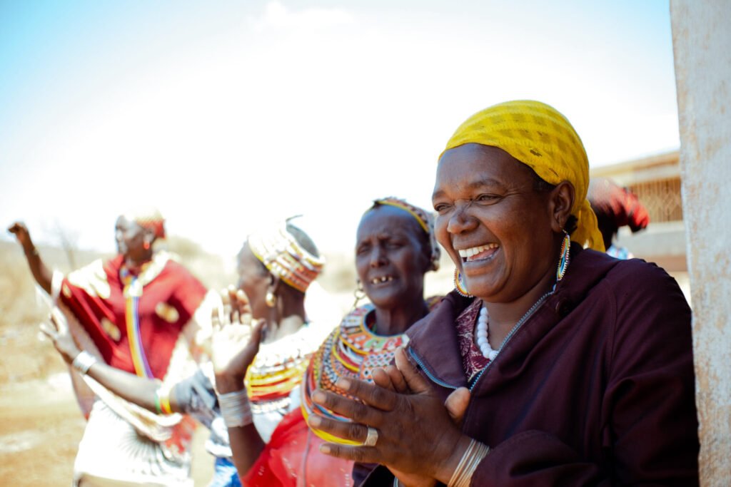kenya lms member of karare milk cooperative clapping in joy marsabit county